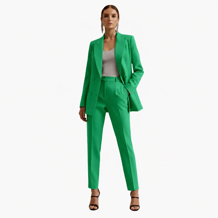Women's tailored formal suit set. Double-breasted blazer with matching trousers for professional style.