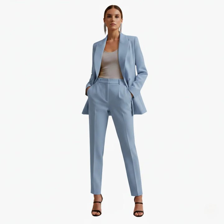 Elegant women's double-breasted blazer and tailored trousers set for formal and professional wear.