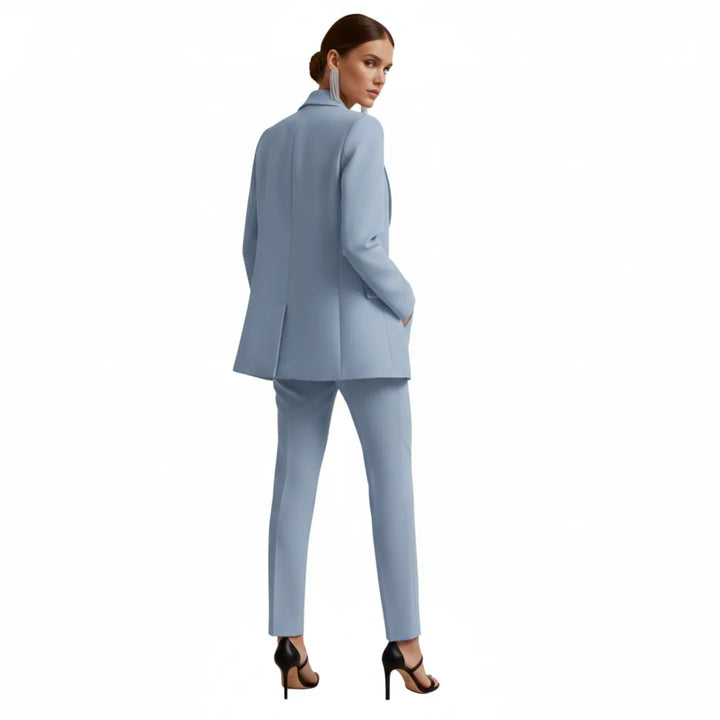 Stylish women's professional suit set. Double-breasted blazer with matching tailored trousers.