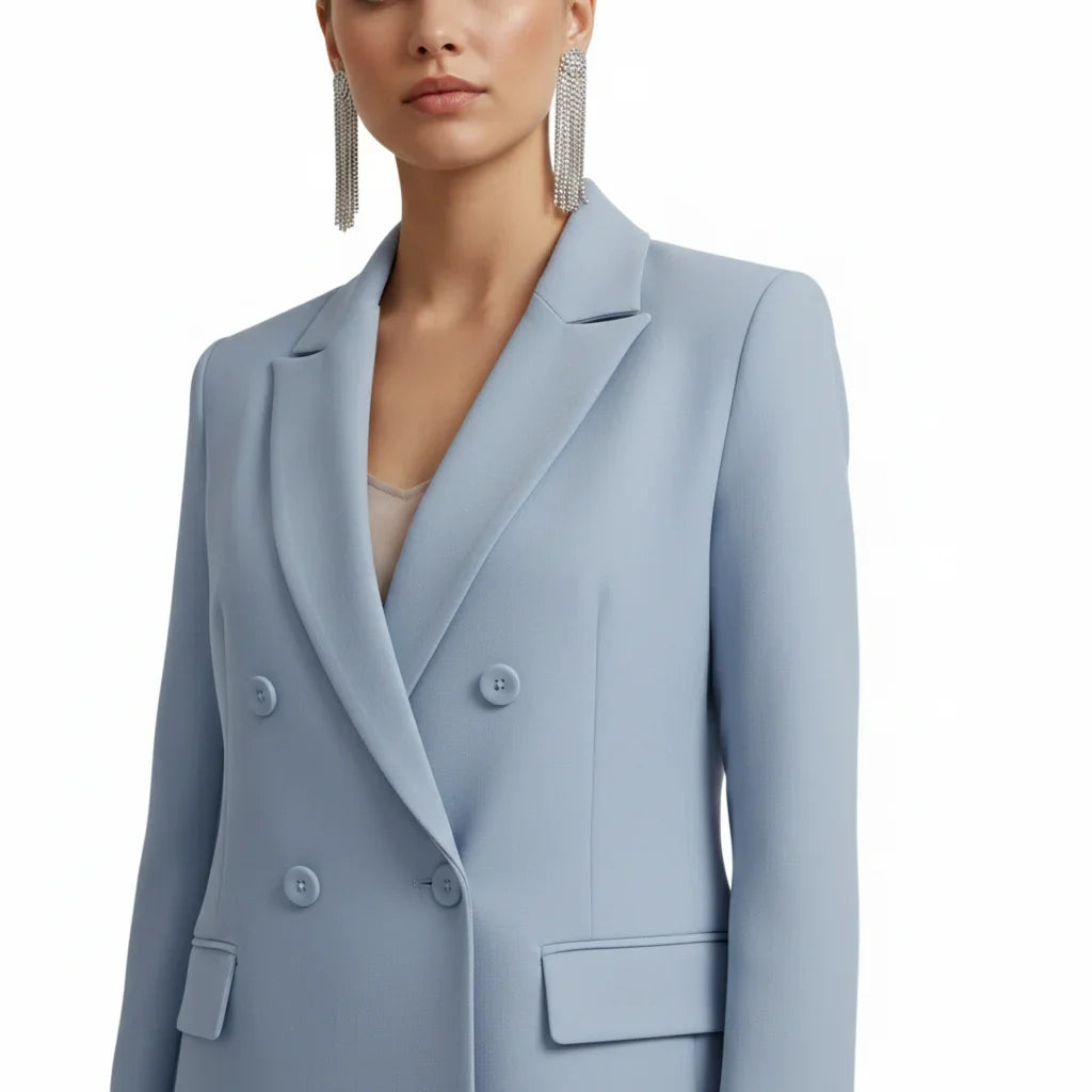 Sophisticated women's suit set. Double-breasted blazer & tailored trousers for elegant formal wear.