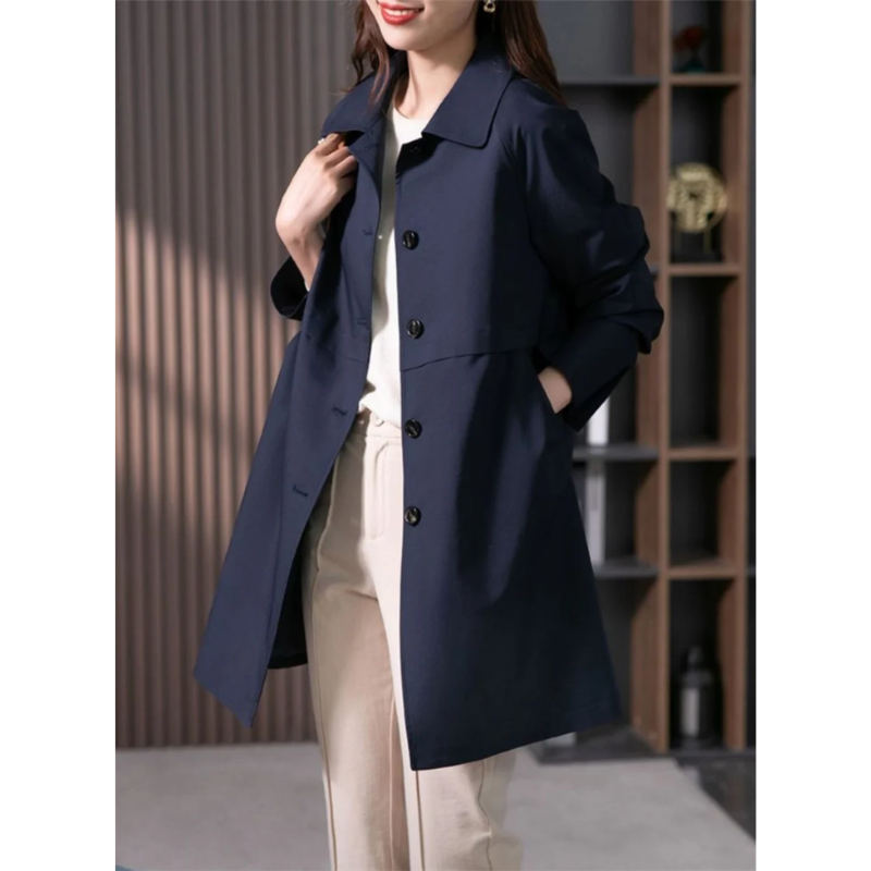 Classic trench coat for women, sophisticated tailored fit. Versatile jacket for elegant spring and fall fashion.