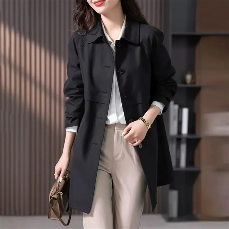 Elegant women's trench coat, tailored and mid-thigh length. A classic versatile jacket for spring and fall fashion.
