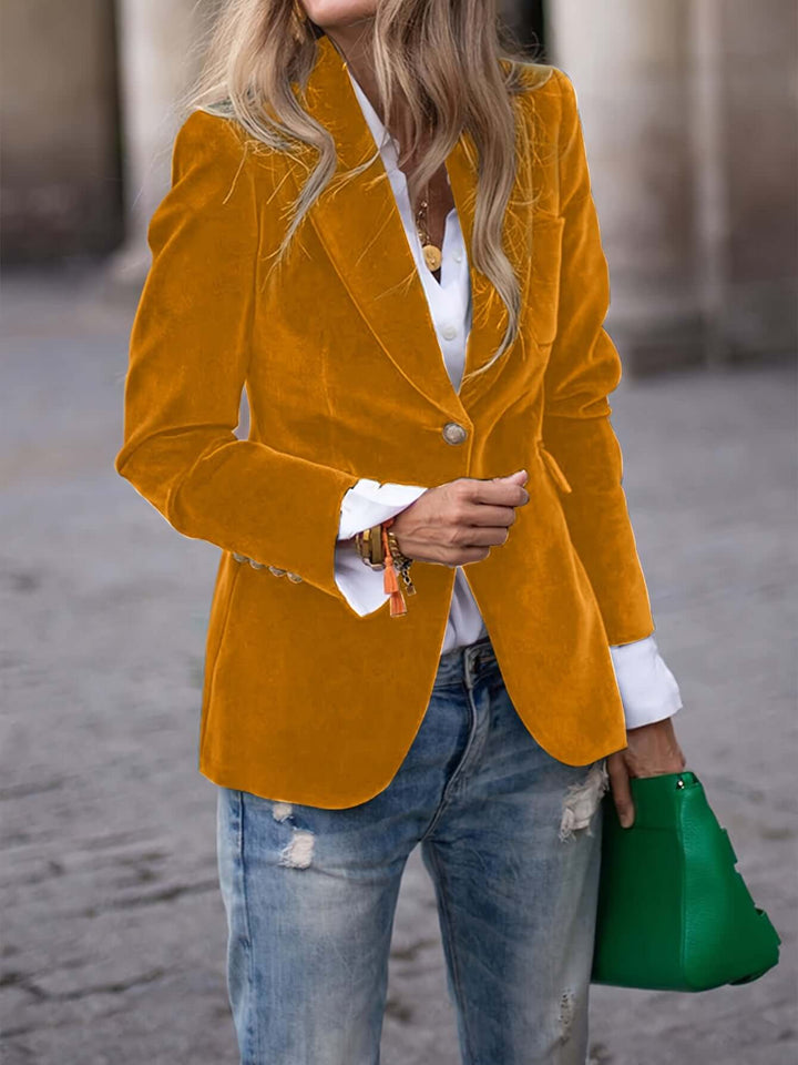 Sophisticated women's green blazer jacket, featuring a structured cut & polished golden buttons.