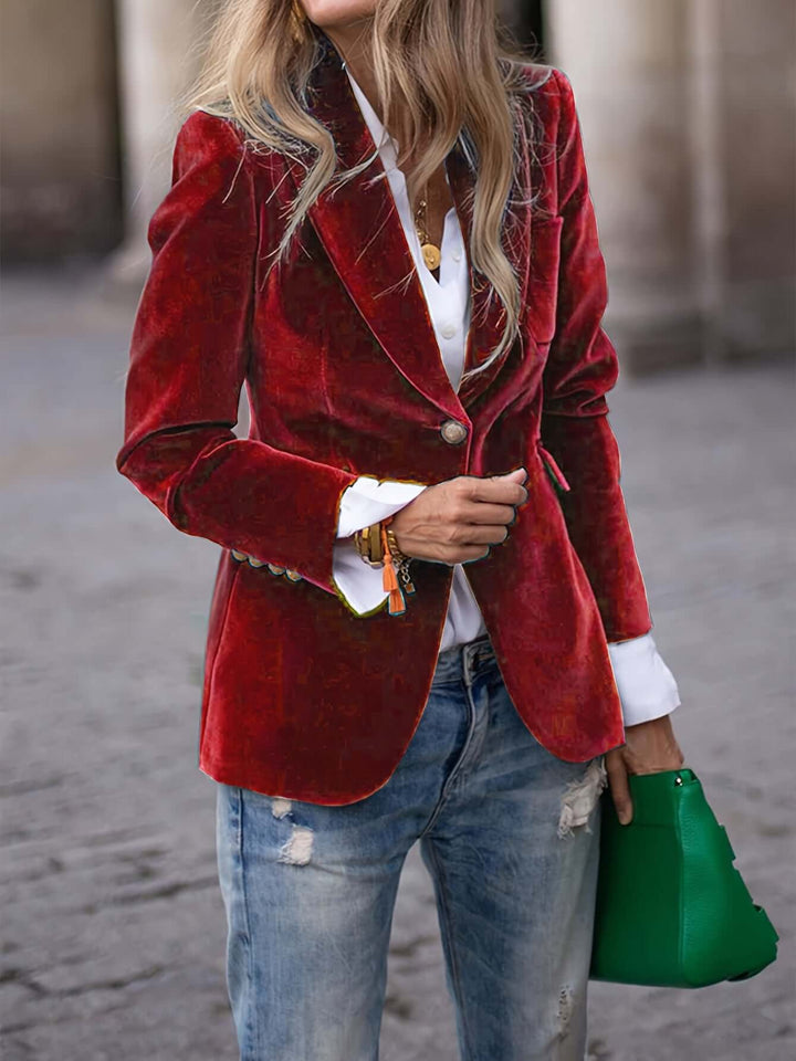 Professional women's green blazer, tailored for a sharp silhouette, adorned with golden buttons.
