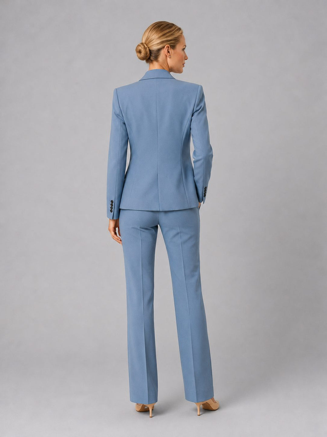 Elegant women's tailored high-waist straight leg trousers. Part of a formal business suit set for work.
