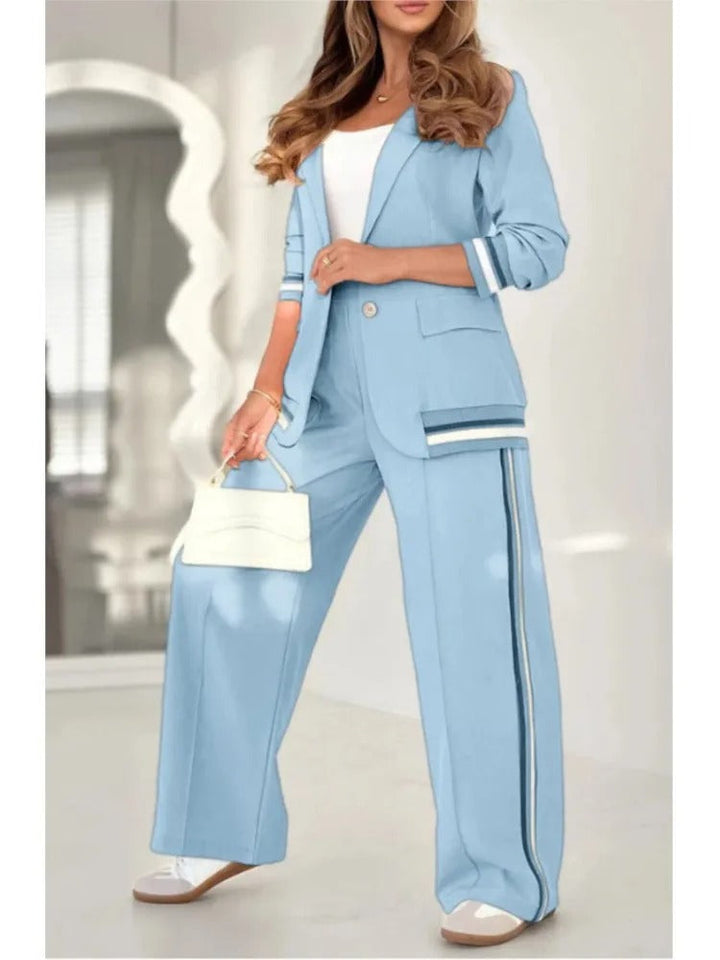Back view of elegant women's tailored lounge set: chic blazer & straight trousers. Coordinated two-piece.