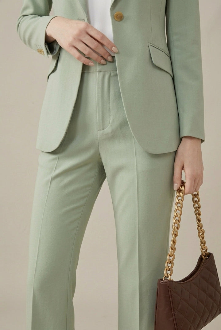 Elegant sage green women's pant suit: tailored blazer with stylish shawl collar & straight-leg trousers.