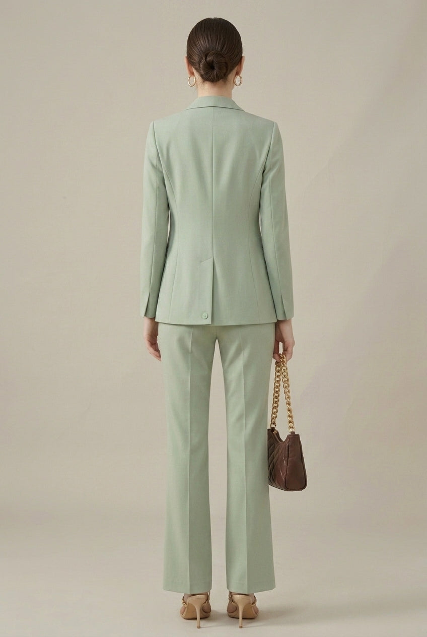 Professional black women's two-piece suit. Tailored blazer, shawl collar & smart straight-leg trousers.