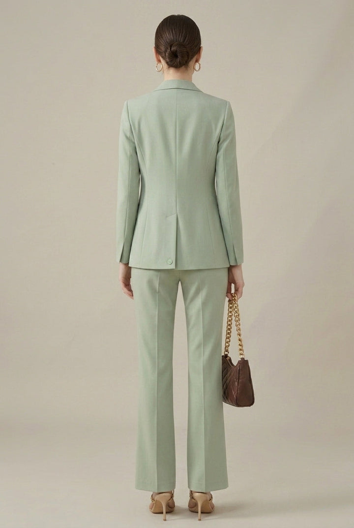 Professional black women's two-piece suit. Tailored blazer, shawl collar & smart straight-leg trousers.