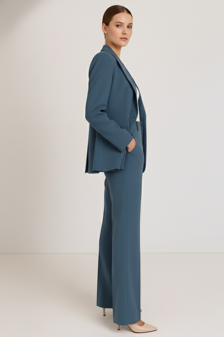 Chic tailored women's two-piece pantsuit. Elegant blazer & slim trousers for formal workwear & business.