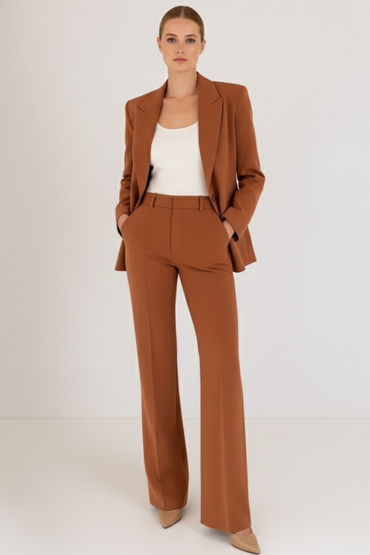 Elegant women's tailored pantsuit. Chic blazer and comfortable trousers, ideal for office and professional style.