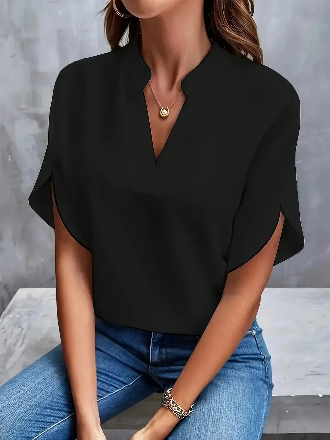 Women's V-neck short sleeve blouse, tailored and refined. Ideal business casual or office wear top.