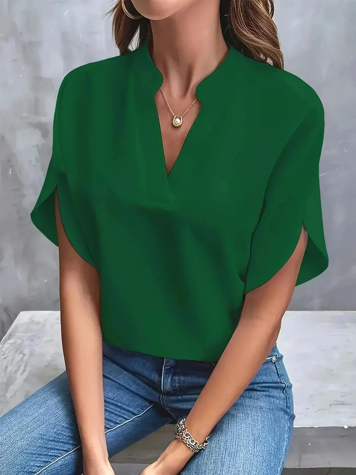 Chic women's tailored V-neck blouse with unique split short sleeves, a sophisticated addition to any wardrobe.