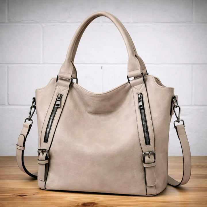 Trendy tan faux-leather slouchy crossbody shoulder bag, a must-have women's fashion accessory.