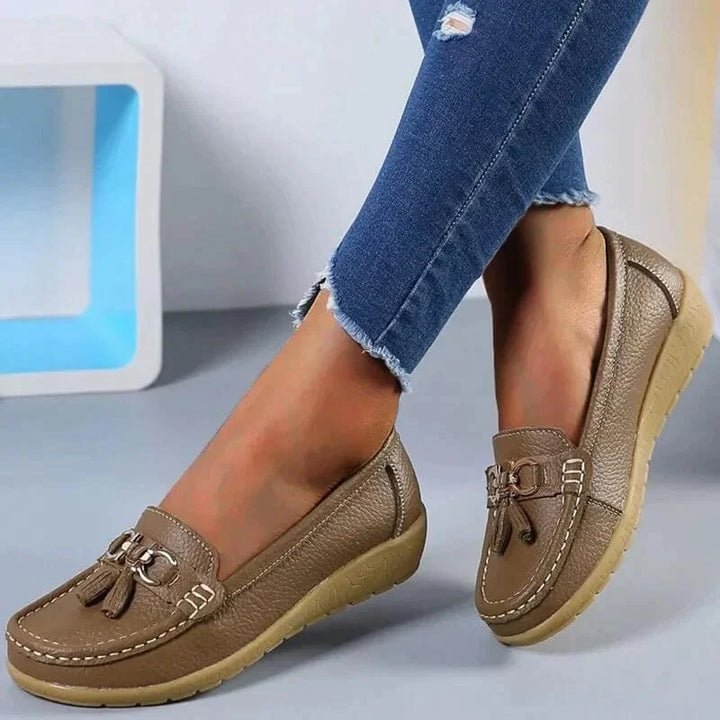 Smart casual women's tassel loafers, easy slip-on style, gold hardware, and comfortable moc toe.