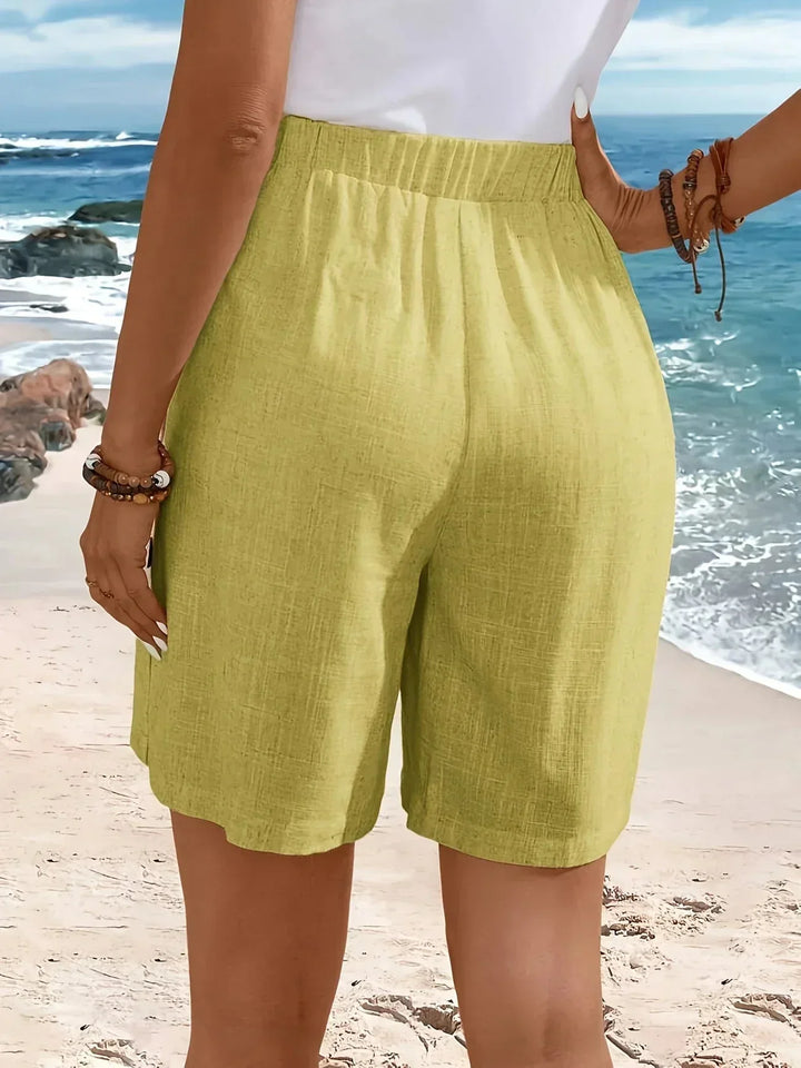 Rear view of women's textured high-waisted wide-leg shorts, emphasizing the comfortable, breezy wide-leg fit.