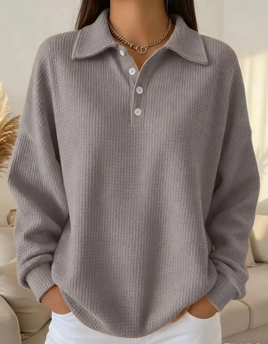 Chic women's textured knit polo sweater with long sleeves & button placket, a comfortable and stylish autumn top.