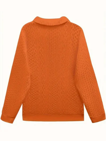 Modern women's textured knit quarter-zip, long sleeve sweater, ideal for fall/winter.