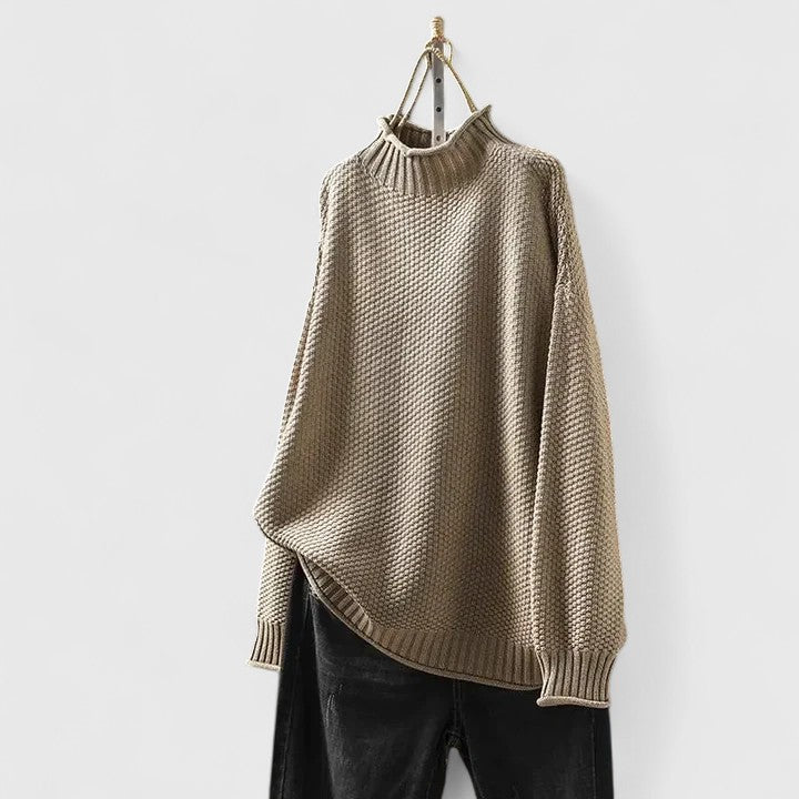 Stylish women's mock neck sweater featuring a captivating textured knit & relaxed silhouette.