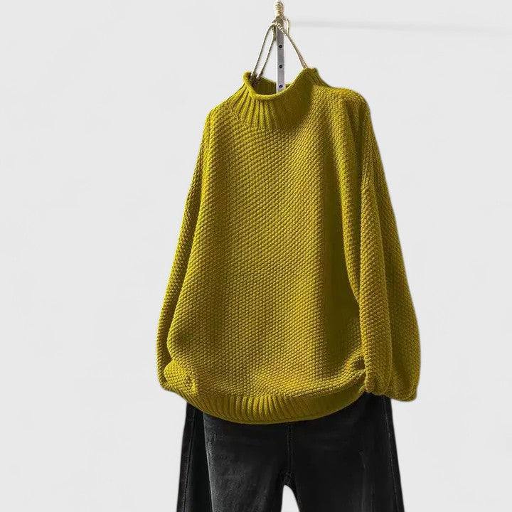 Elegant women's long sleeve mock neck jumper with a unique textured knit pattern.