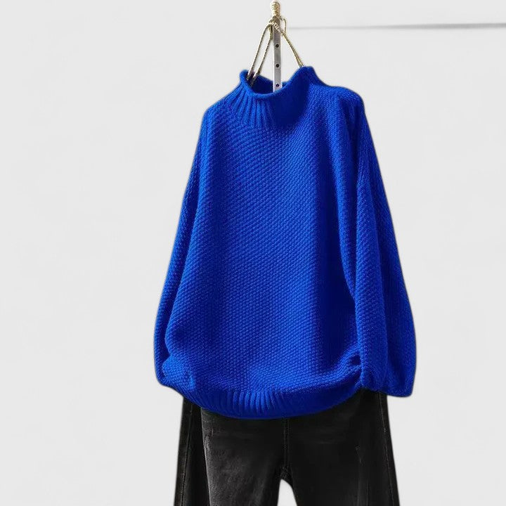 Model wearing a cozy women's textured mock neck sweater; relaxed fit, ideal for winter.