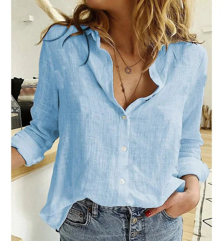 Comfortable relaxed fit long-sleeve V-neck blouse for women, stylish everyday wear.