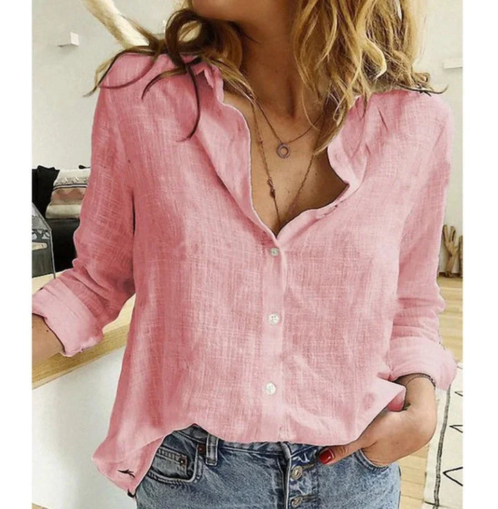 Versatile women's textured V-neck blouse; ideal for office wear or casual outings.
