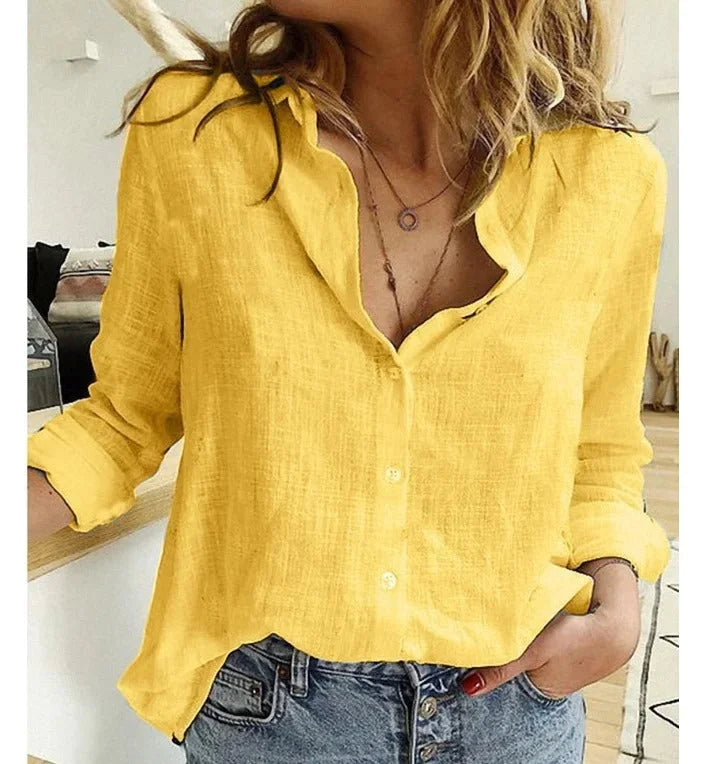 Soft textured fabric V-neck long-sleeve blouse, relaxed fit for women's casual style.