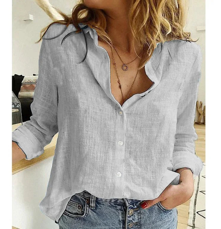 Stylish women's textured V-neck button-down long-sleeve blouse, relaxed and versatile.