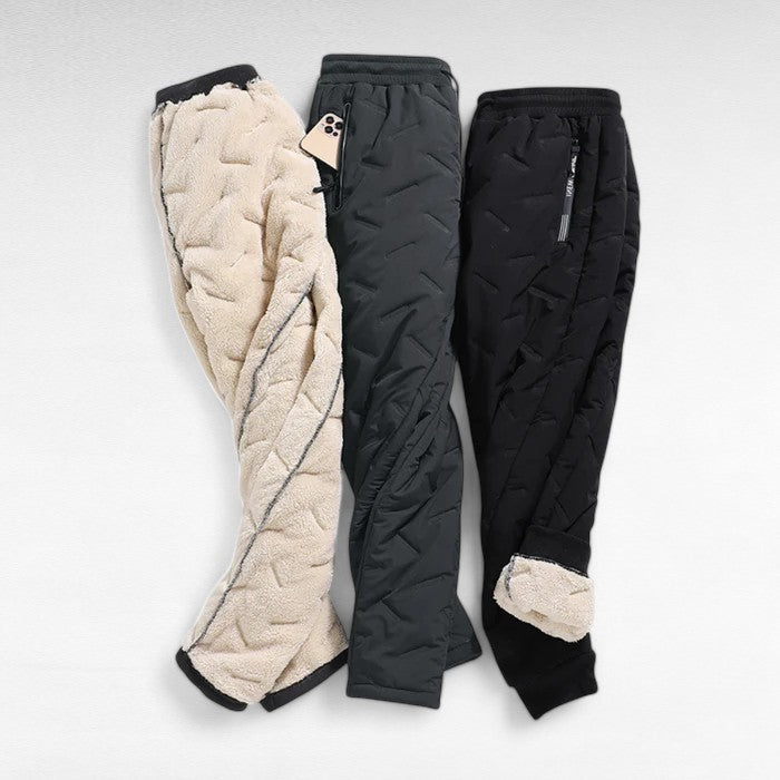 Women's waterproof & windproof thermal trousers, offering ultimate protection for extreme cold winter adventures.