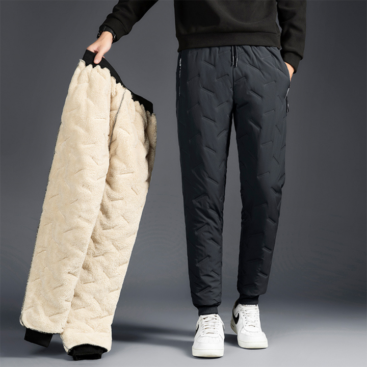 Stylish women's thermal waterproof pants (grey/black), essential for winter outdoor adventures & warmth.