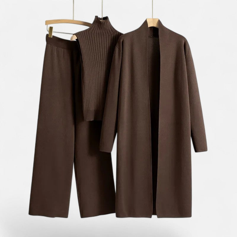 Modern women's knit trouser set with a coordinating vest and cardigan.