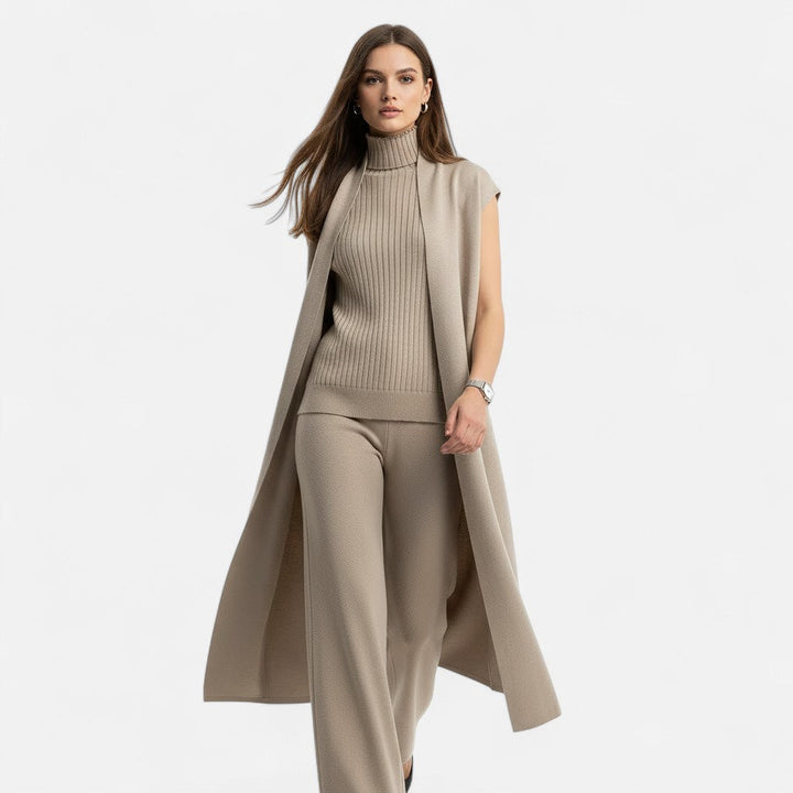 Cozy fall fashion: women's knit vest, cardigan, and matching trouser set.