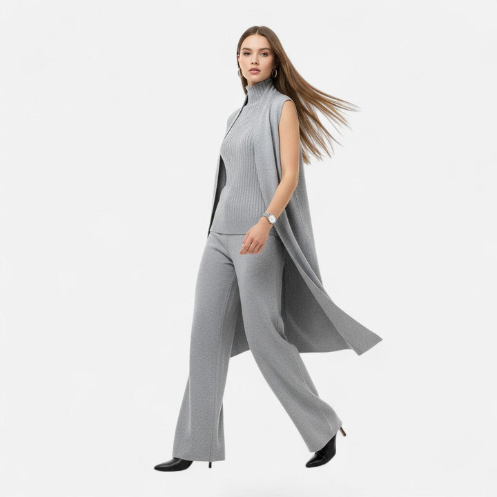 Chic women's three-piece set: knit vest, oversized cardigan, and trousers.