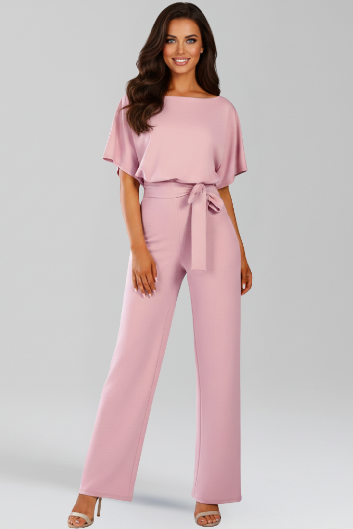 Relaxed fit women's wide-leg jumpsuit with self-tie belt. Ideal summer wear for a comfortable, stylish look.