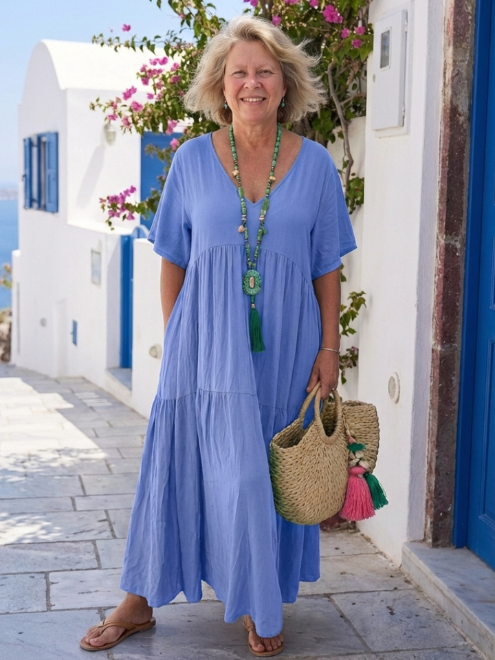 Black tiered maxi dress, a versatile short-sleeve summer dress for women, ideal for warm weather.