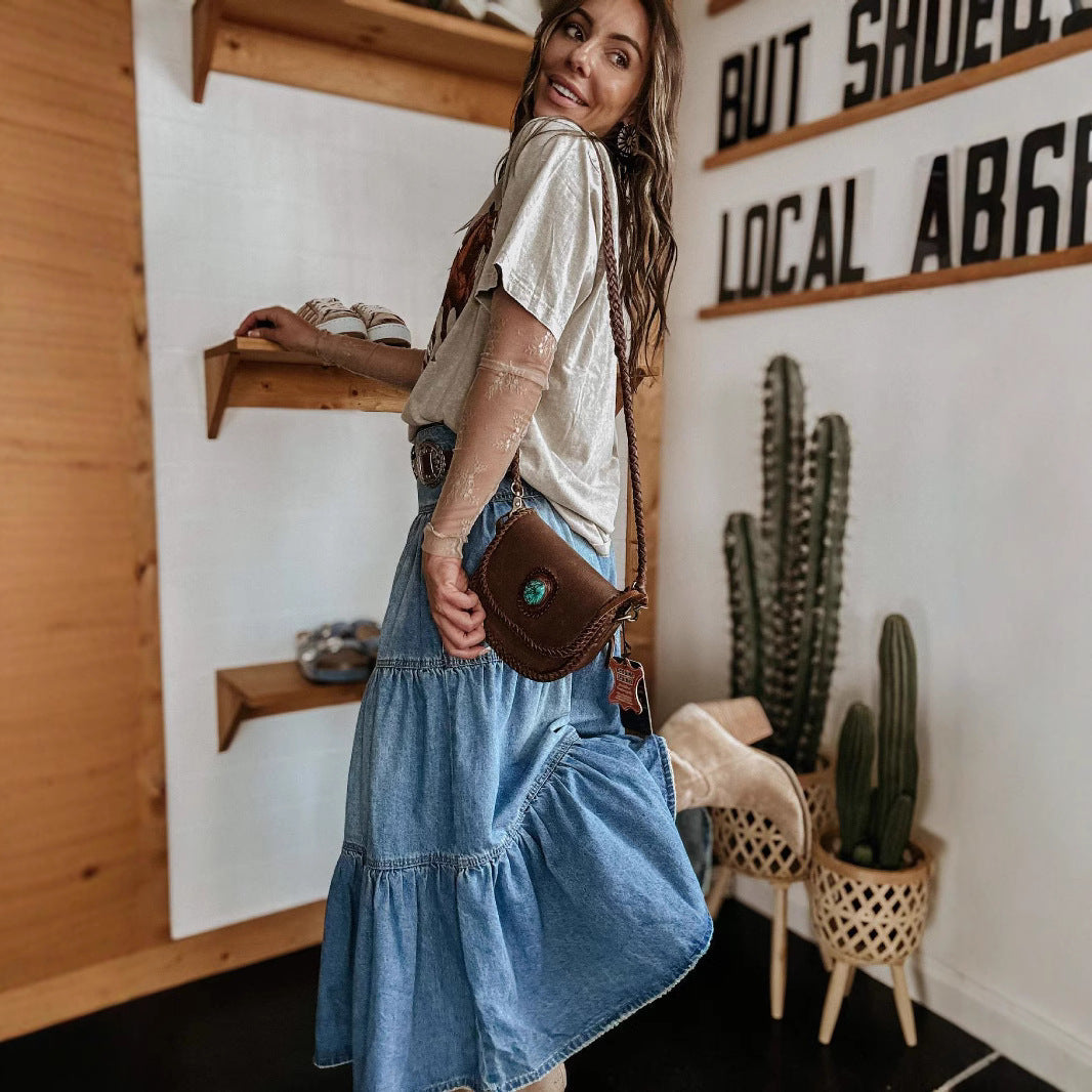Casual women's tiered maxi skirt with a button front closure and distinctive raw hem detail.