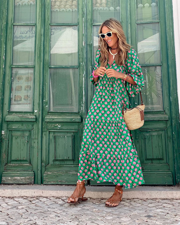 Elegant women's tiered maxi dress with balloon sleeves and a beautiful floral pattern for summer.