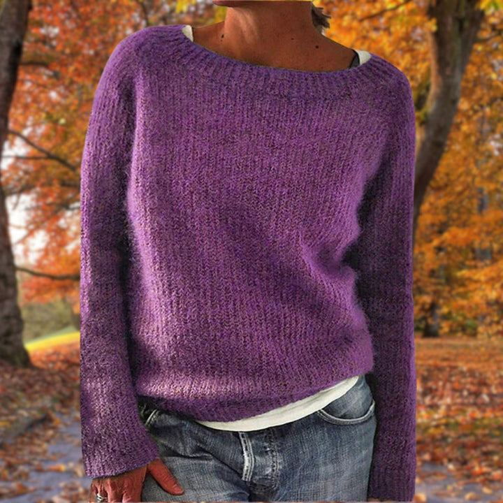 Relaxed fit women's knit sweater, offering timeless comfort. Perfect for everyday autumn & winter fashion.