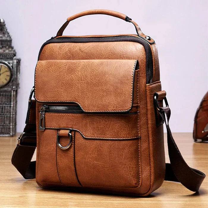 Women's timeless elegant black leather handbag with sophisticated design.