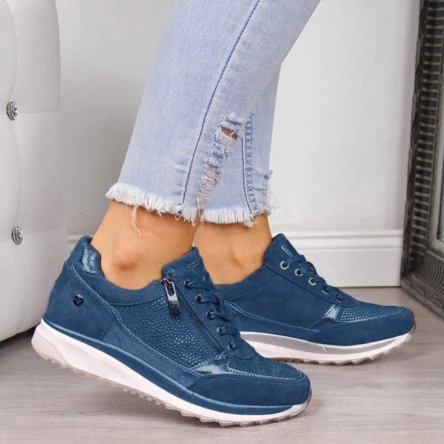 Women's TreadEase slip-on sneakers with convenient zip closure, offering cushioned comfort for walking.
