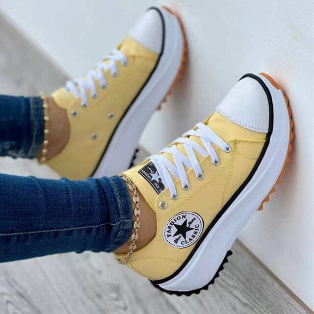A pair of women's orthopedic sneakers in a modern design, highlighting support.