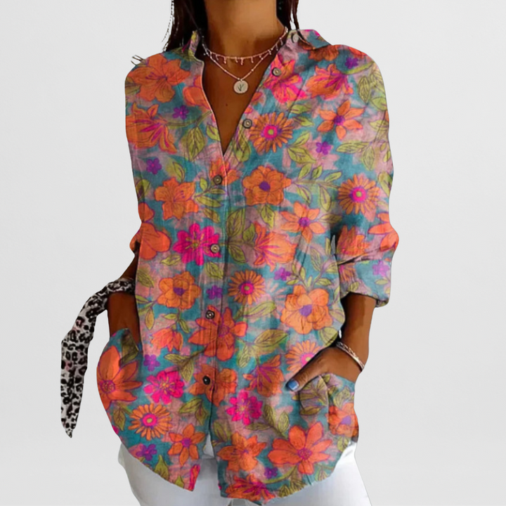 Vibrant tropical floral pattern loose fit women's blouse. Comfortable long sleeve button-down top.