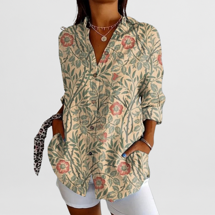 Chic women's loose fit tropical floral blouse. Perfect long sleeve button-down for summer casual wear.