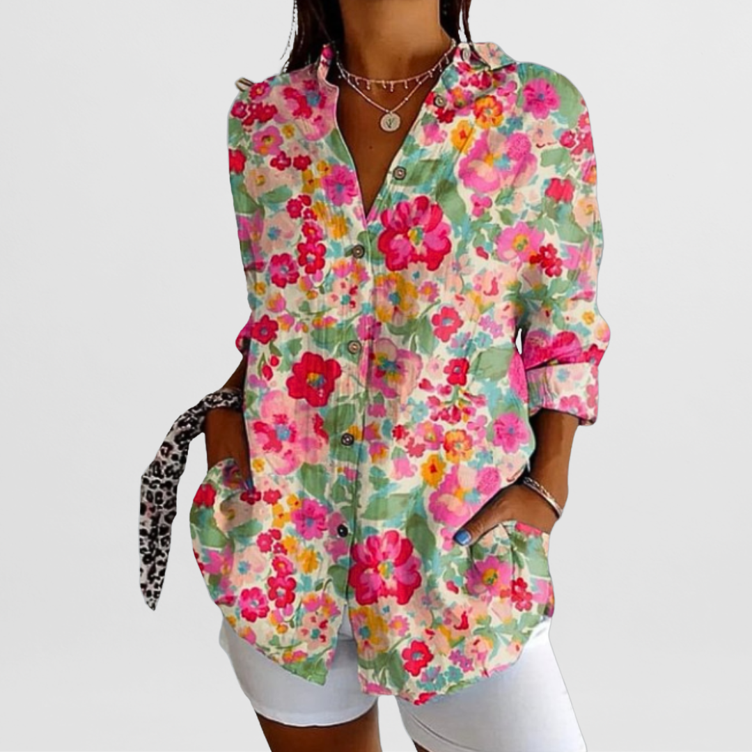 Ladies' tropical floral print blouse with loose fit, long sleeves, and button-down style. Ideal for summer.