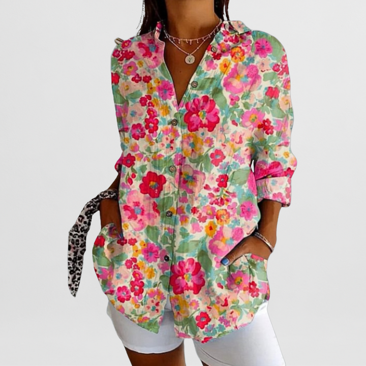 Ladies' tropical floral print blouse with loose fit, long sleeves, and button-down style. Ideal for summer.