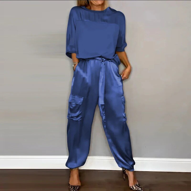 Comfortable plus-size women's outfit set featuring a top and straight-leg drawstring utility pocket trousers.