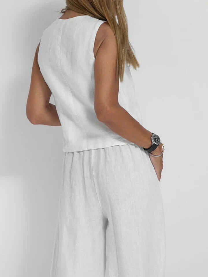Fashionable women's two-piece vest & pant ensemble. A complete matching set for elegant style.