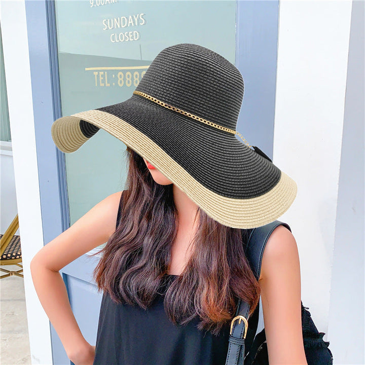 Women's two-tone wide brim straw sun hat for beach & summer. Stylish & packable sun protection.