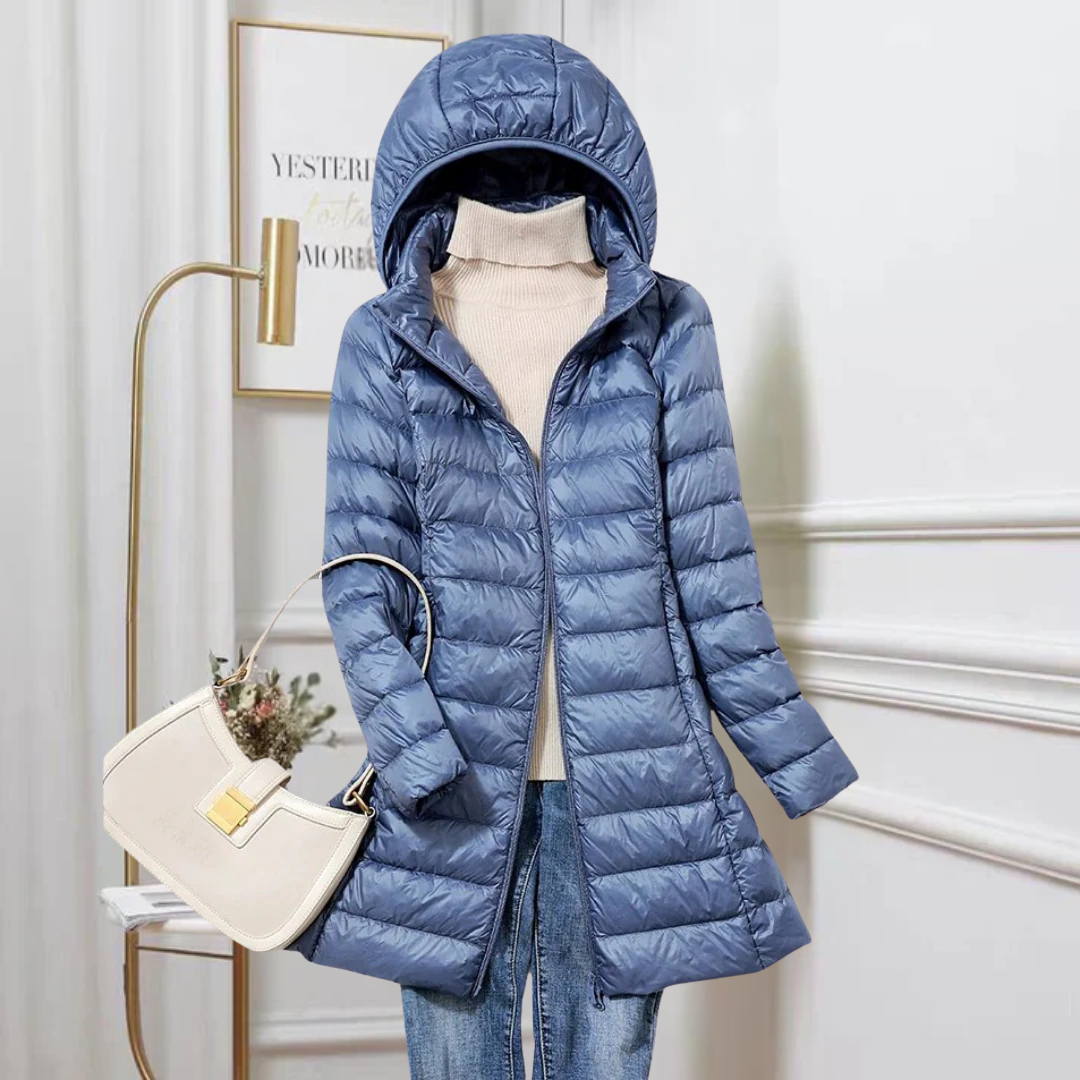Women's ultra-lightweight puffer jacket, packable for travel. Warm, versatile autumn/winter outerwear.